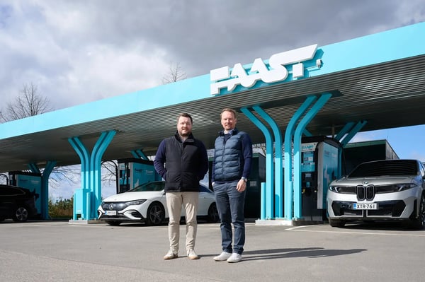 Antti Sario, COO and Heikki Hintikka, CCO standing front of Faast DC charging station at Helsinki Airport