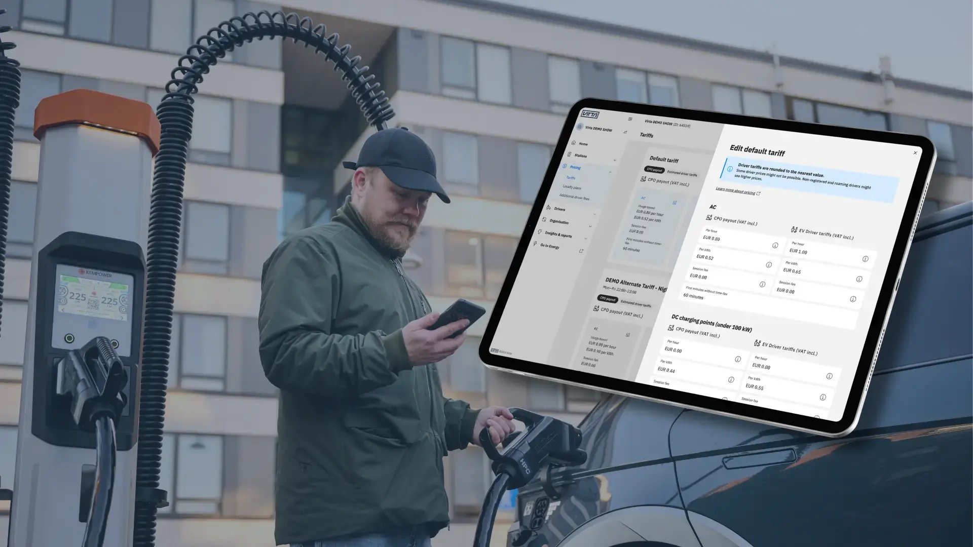 Virta Hub tariff management on iPad Man charging EV in background holding phone in hand