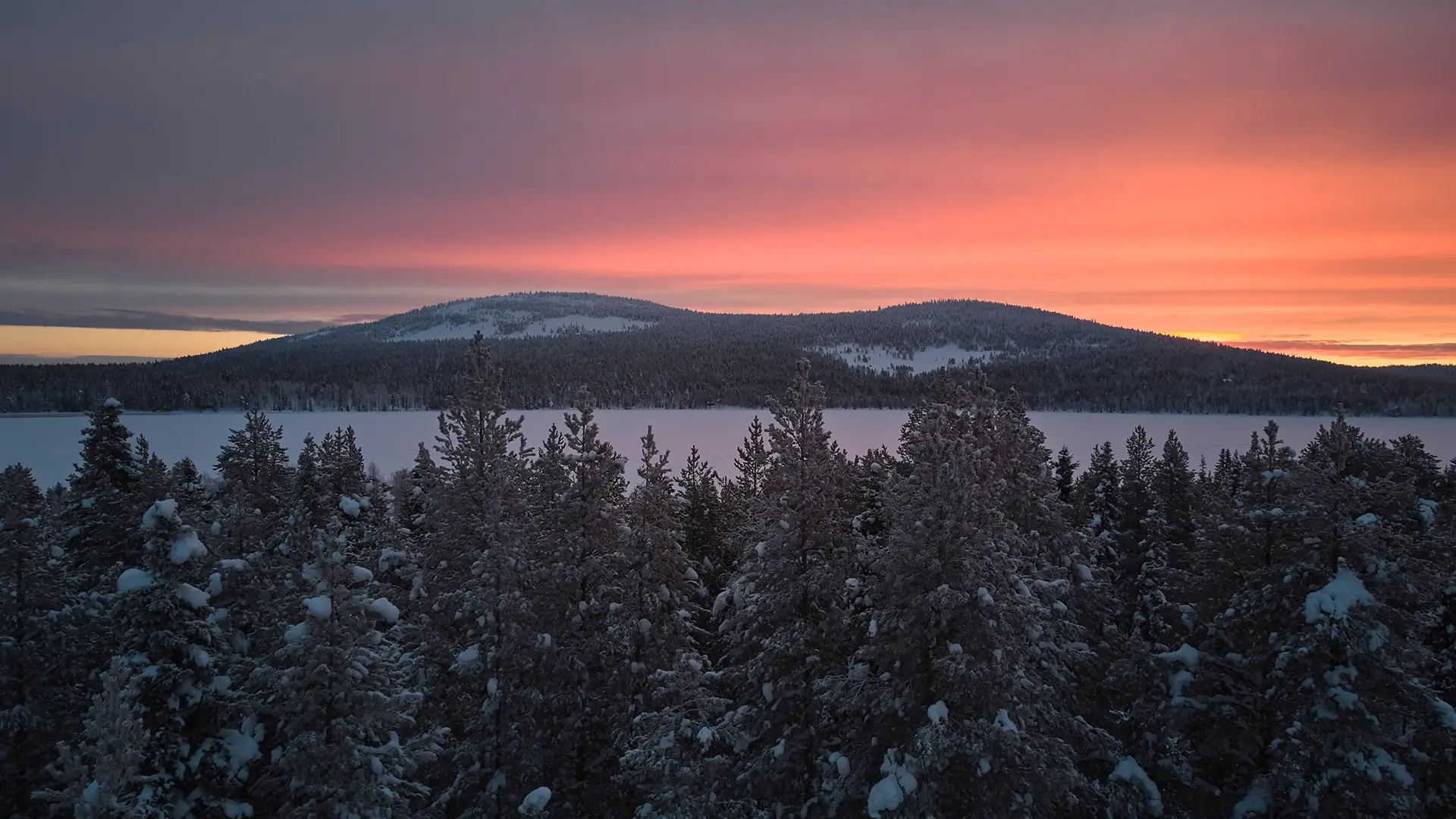 Northern Sweden Lapland snowy landscape sunset glow