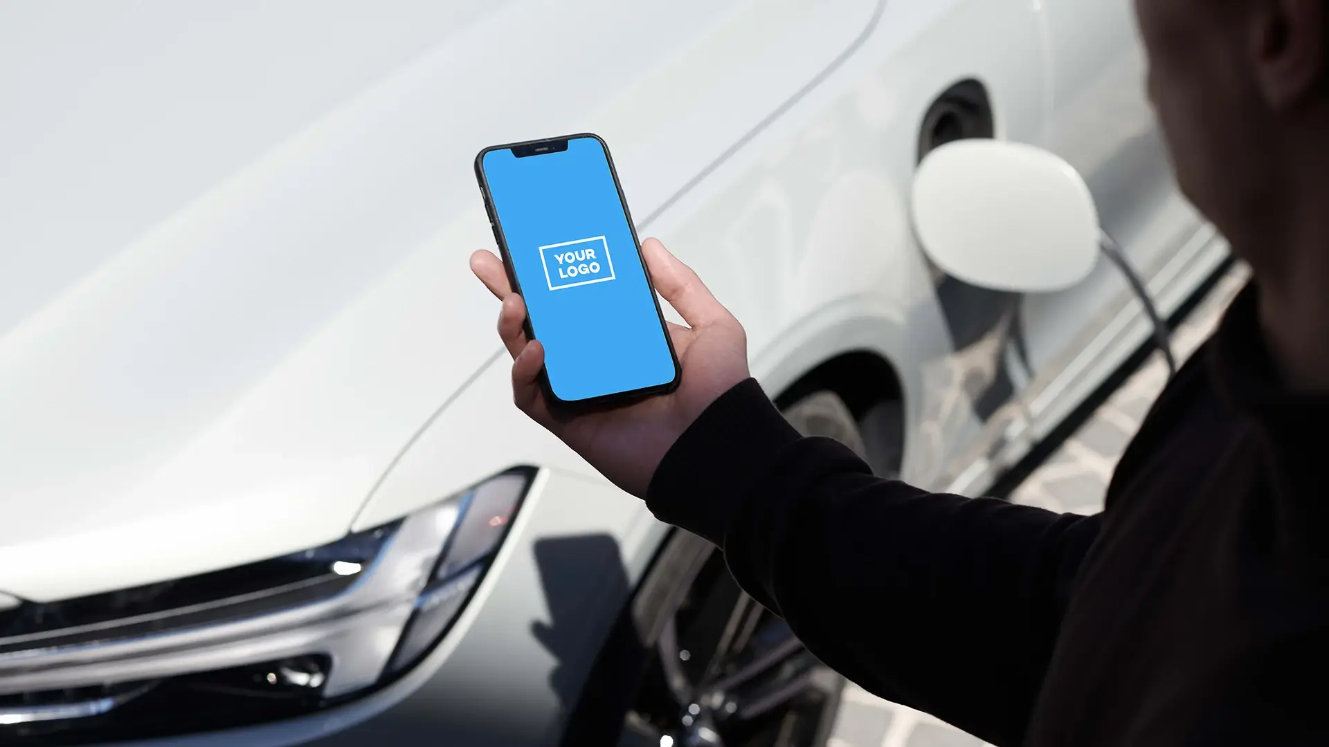 Smartphone EV charging app screen car background
