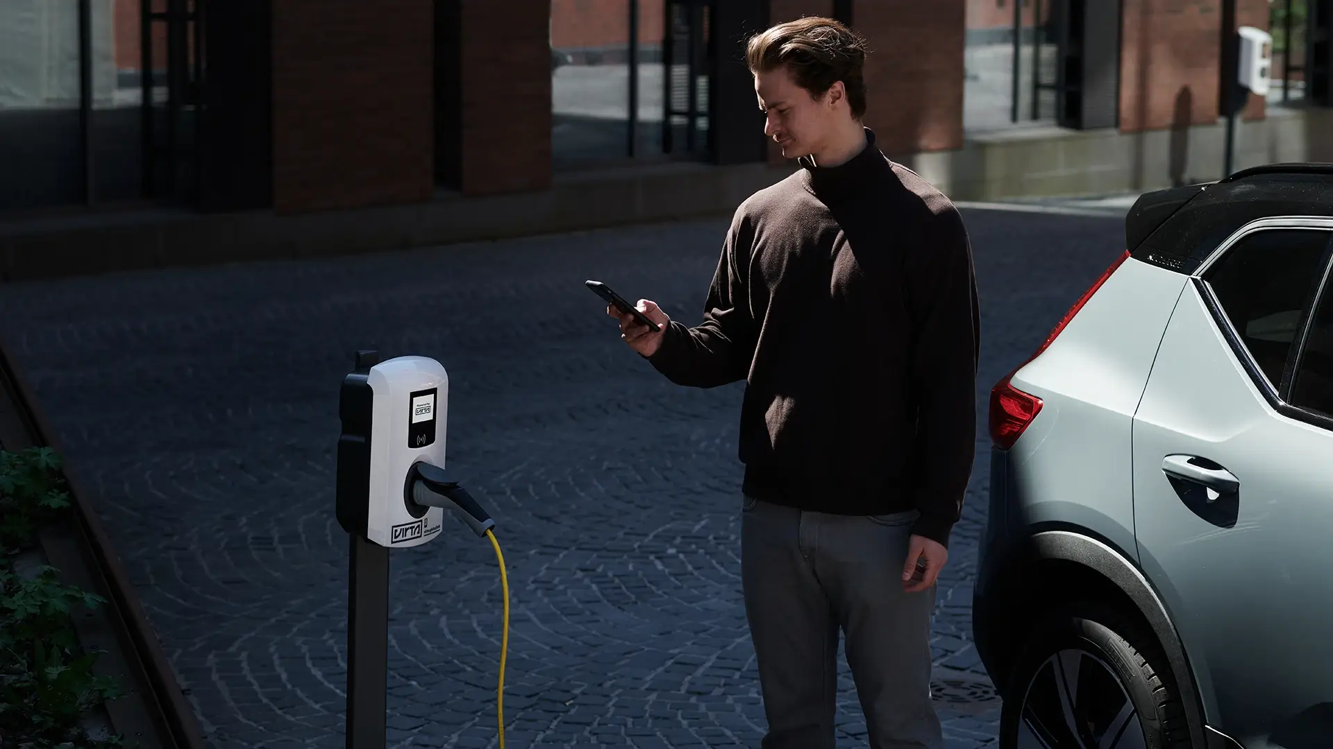 Urban electric car charging smartphone interaction