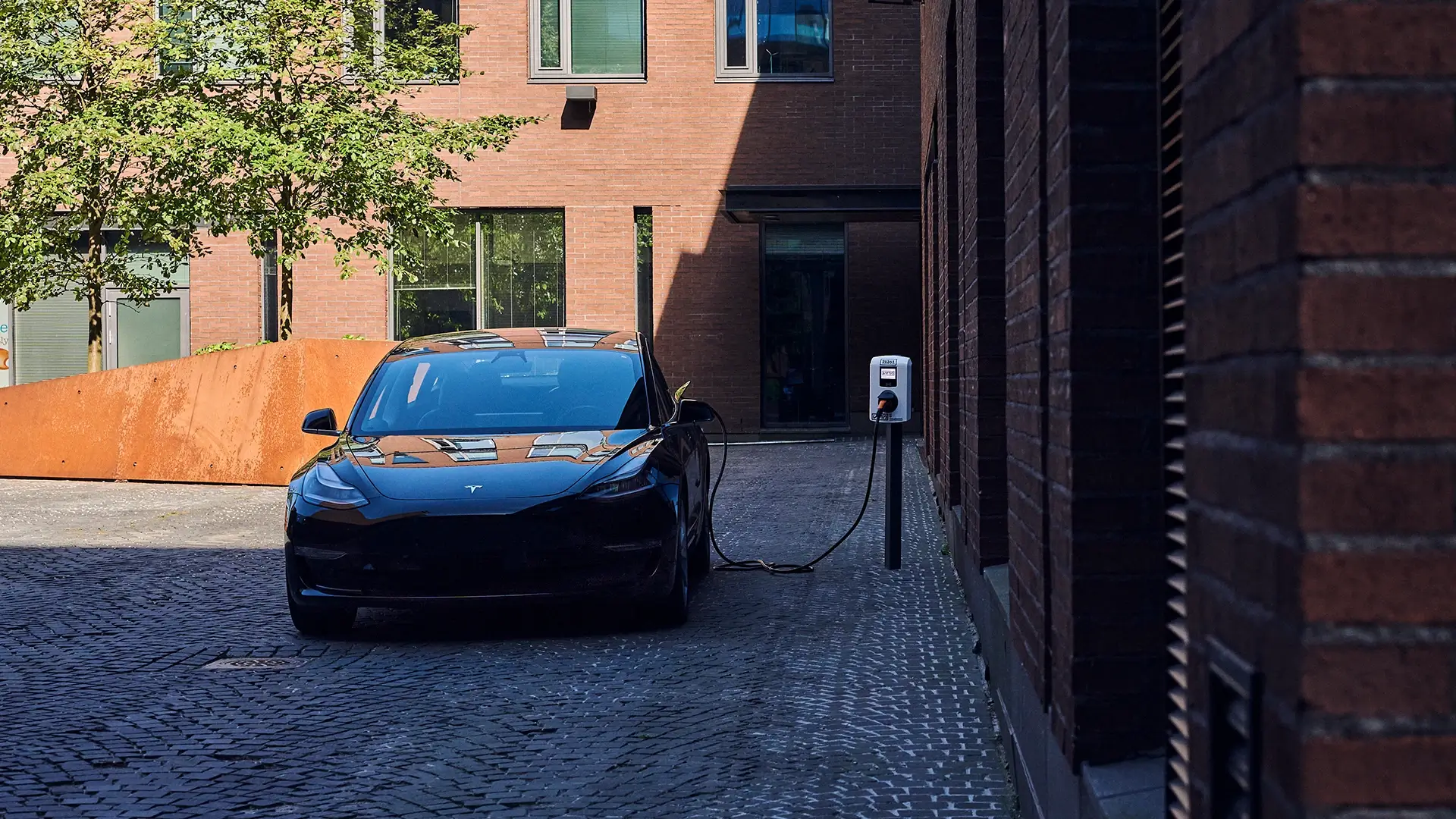 Urban electric vehicle charging brick wall