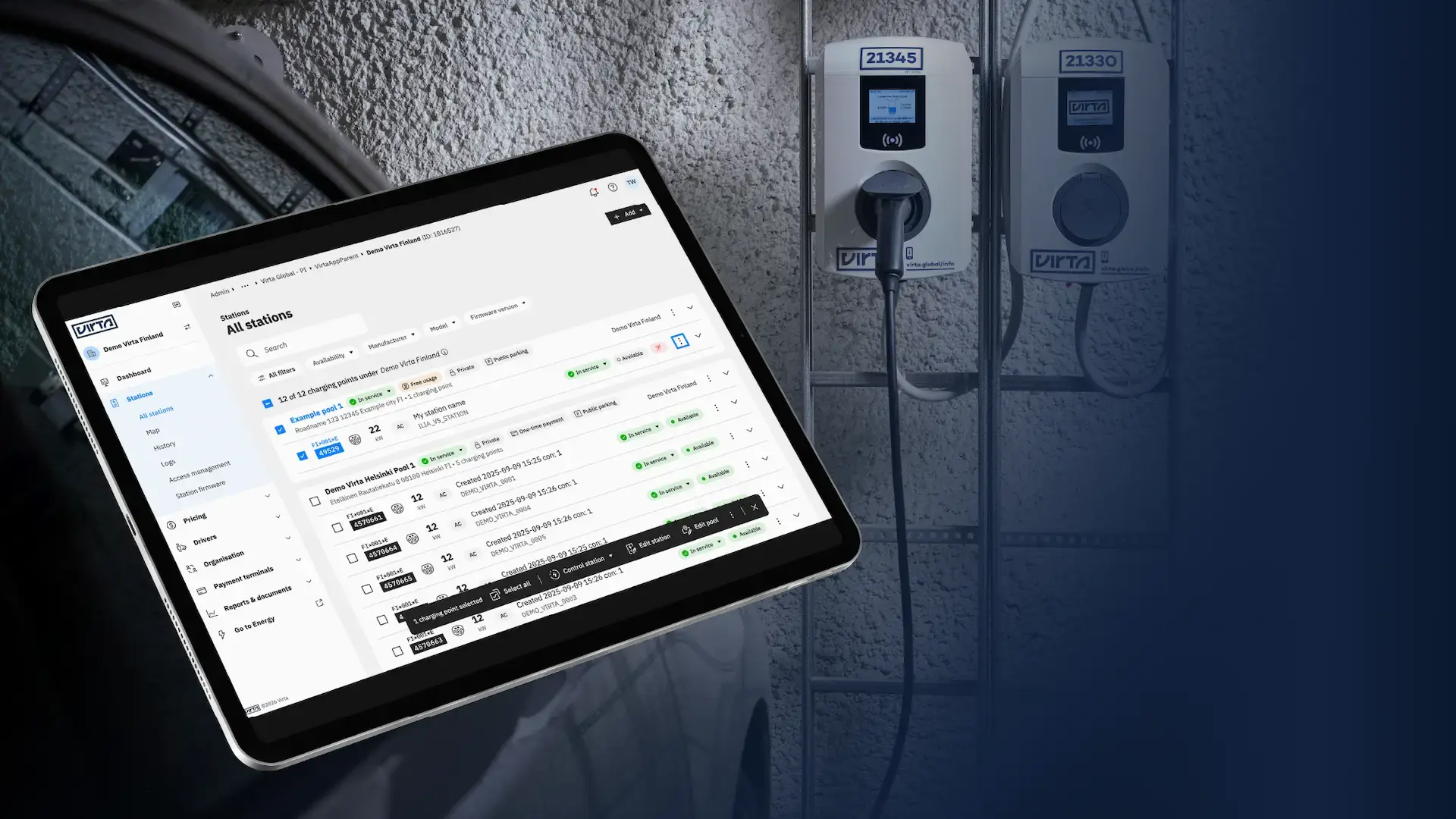 Virta Hub station view UI updates mockup on iPad with two charging stations in the background